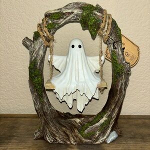 ghost swinging in tree